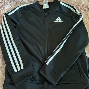 Adidas track suit.